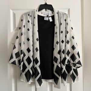 Women’s black and white shirt/jacket combination.